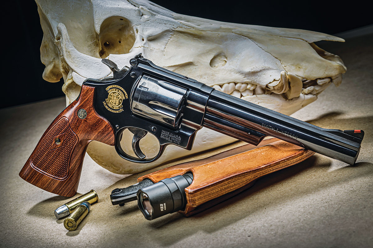 The Smith & Wesson 50-year commemorative Model 29 in 44 Magnum. Unlike Dirty Harry in his profession, most of us enjoy the Model 29 as one of the best hunting handguns ever. The hog skull confirms success.
